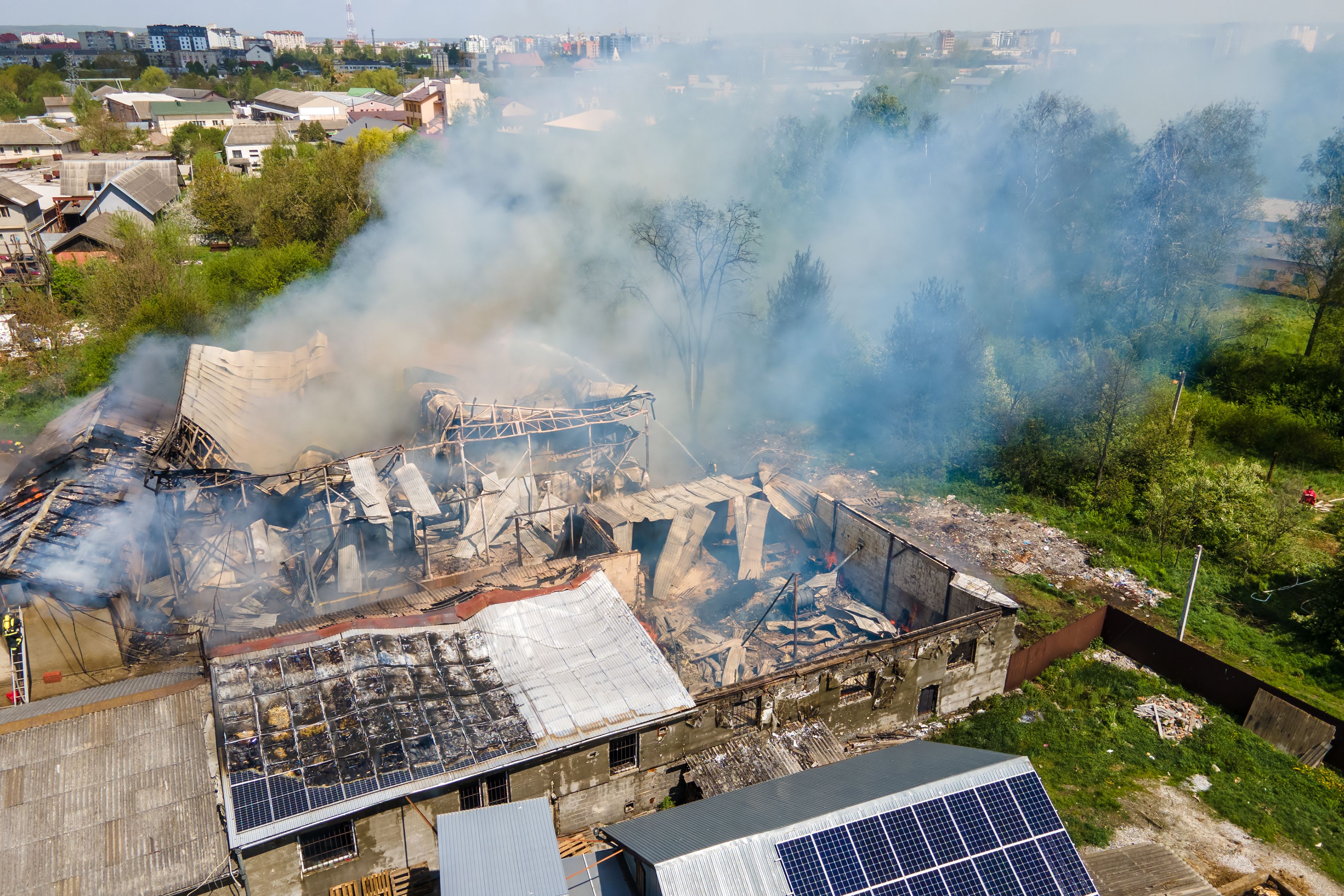 aerial-view-of-ruined-building-on-fire-with-collap-2023-11-27-04-57-21-utc.jpg