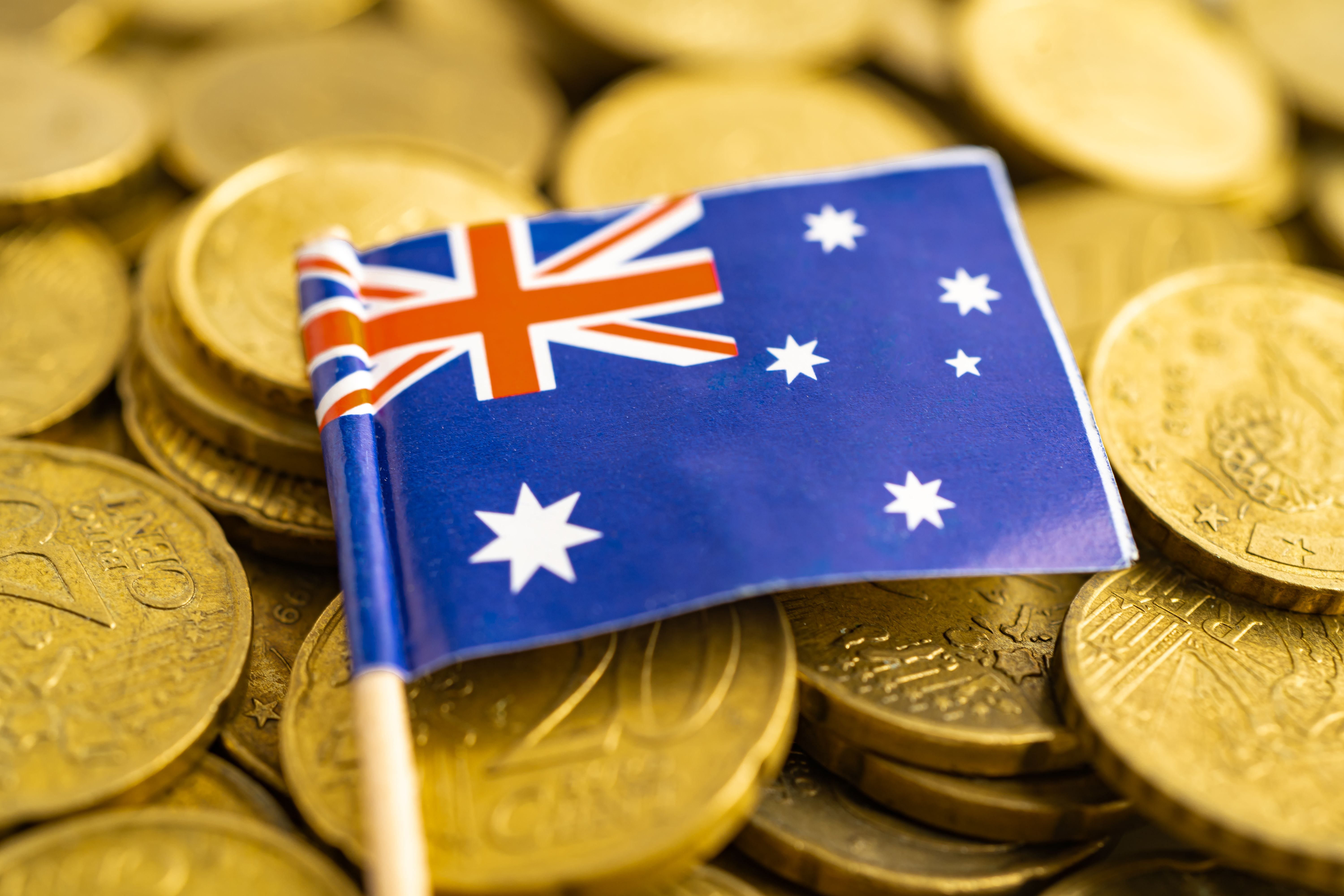 australia-flag-on-coins-money-finance-and-account-2024-01-03-01-51-57-utc.jpg