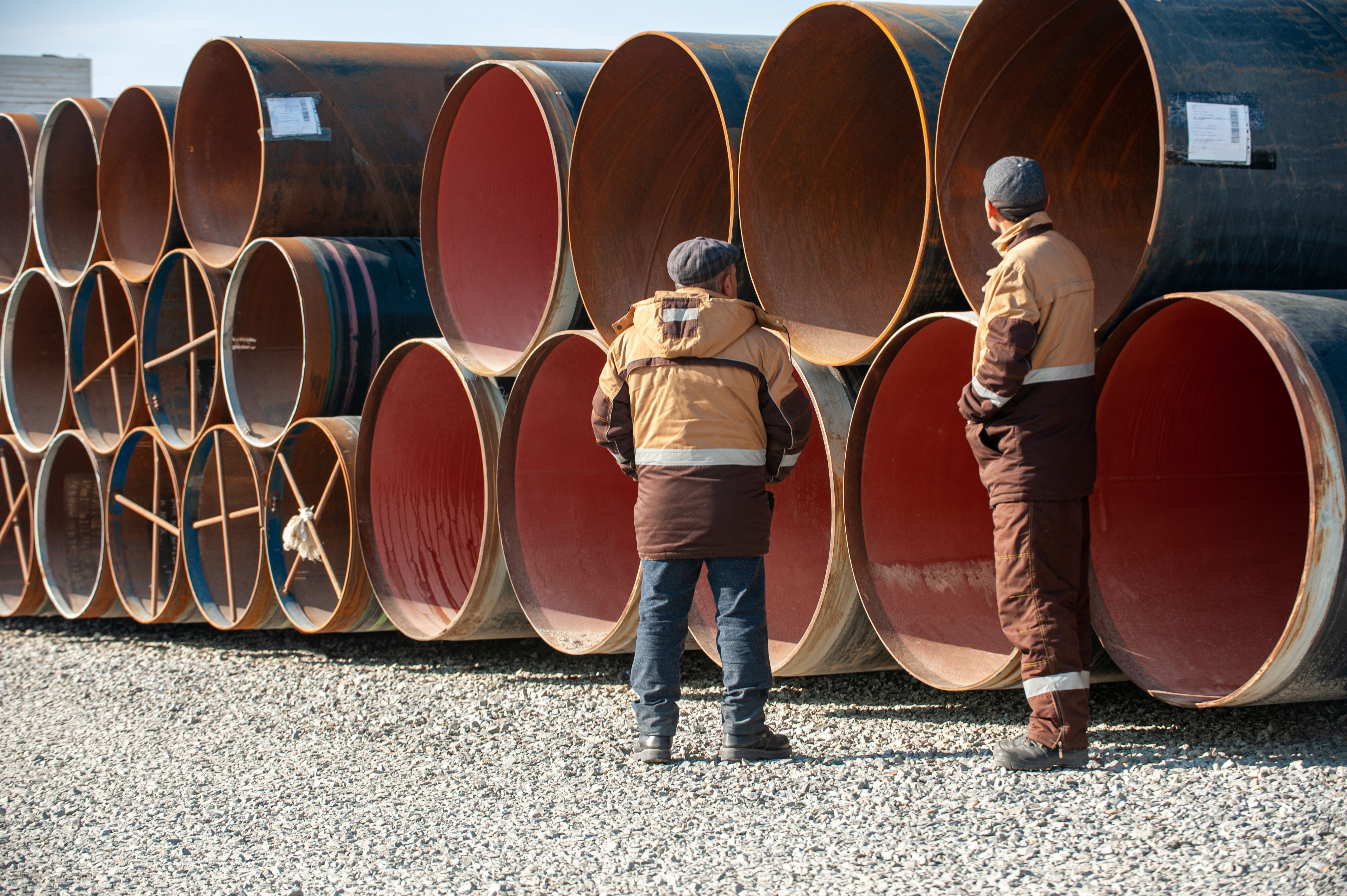 line-of-oilfield-large-streel-pipes-in-industrial-2023-11-27-05-23-47-utc.jpg