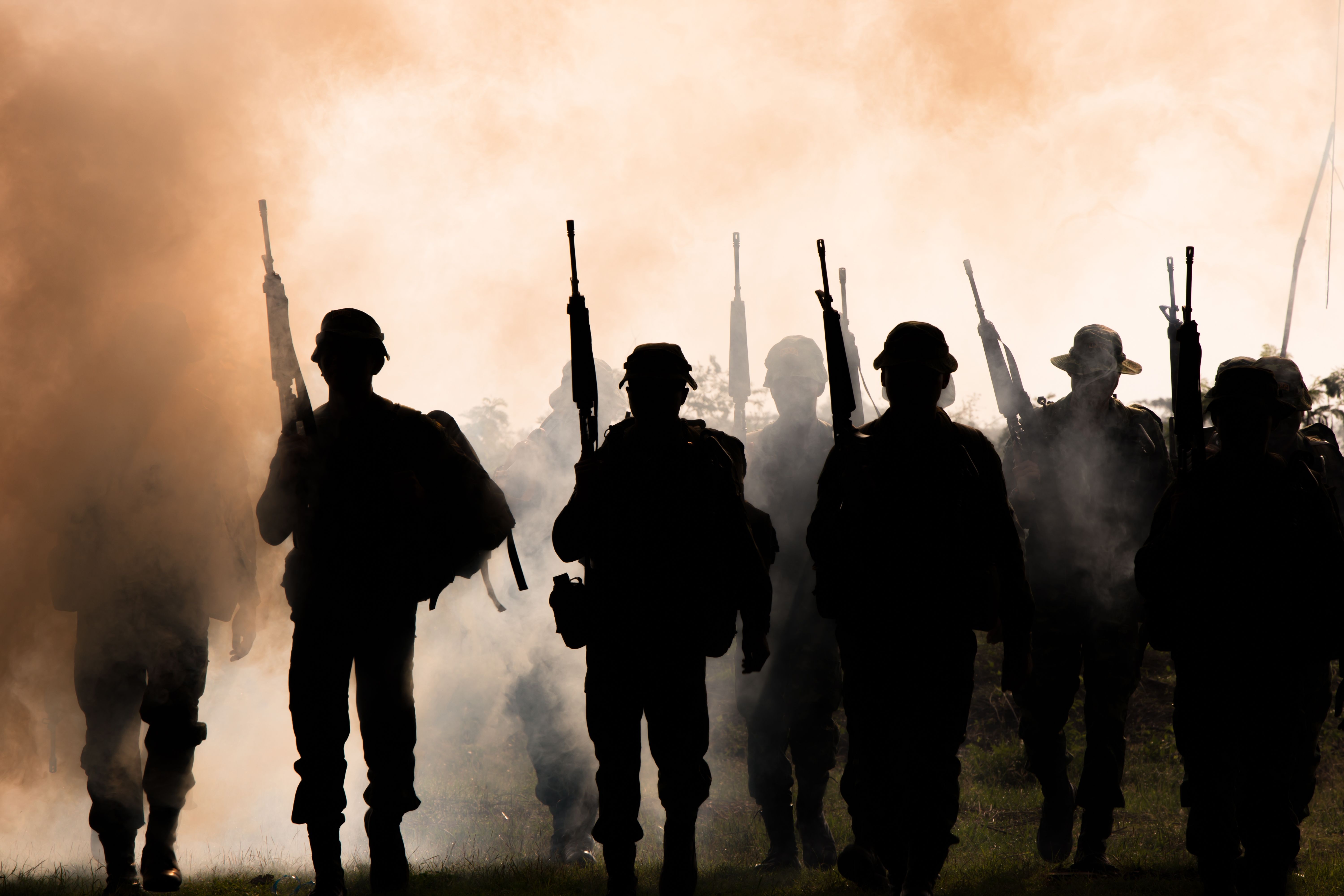 silhouette-of-soldiers-with-rifles-walk-through-sm-2023-11-27-05-24-22-utc.jpg