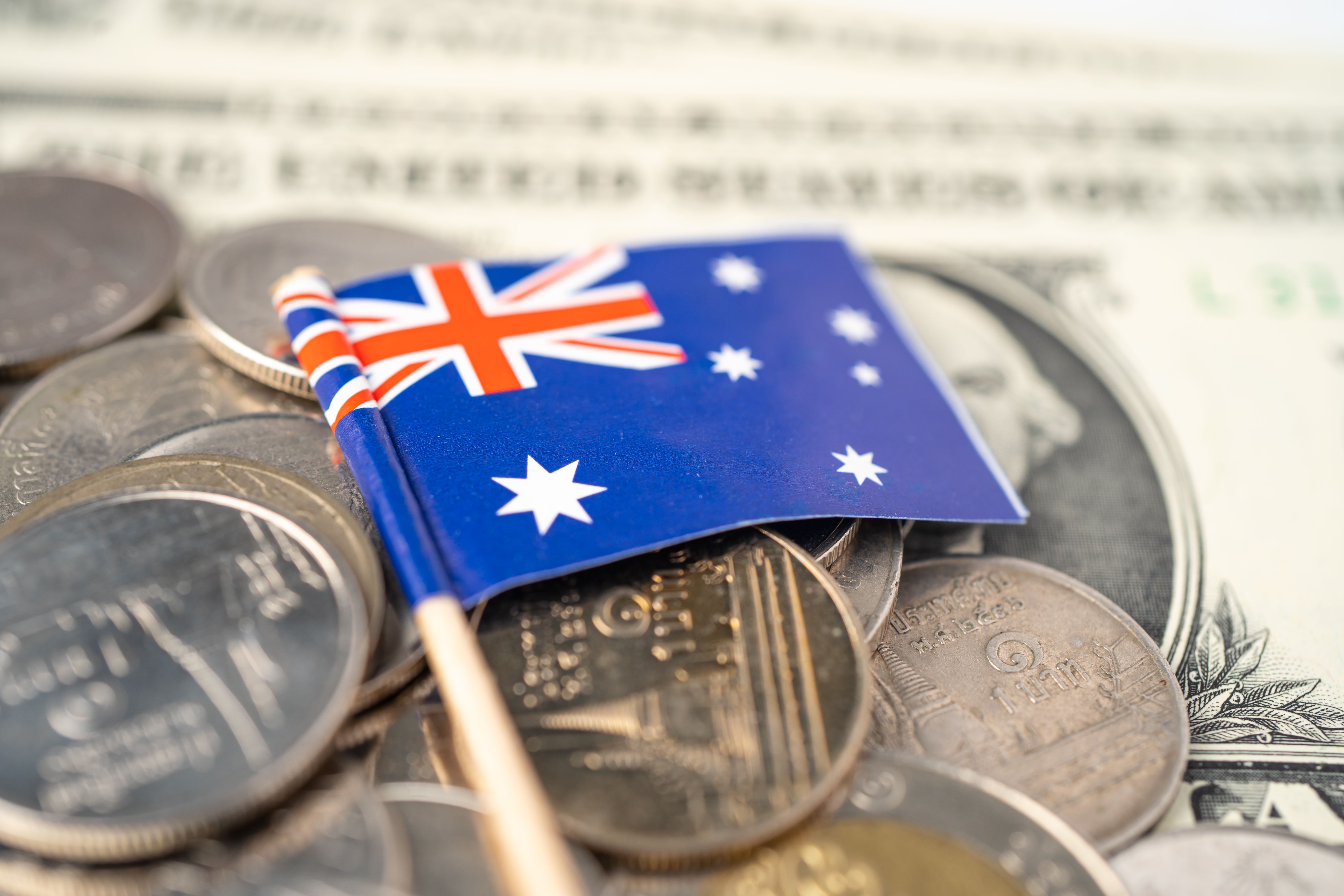 stack-of-coins-with-australia-flag-on-white-backgr-2023-11-27-04-51-02-utc.jpg