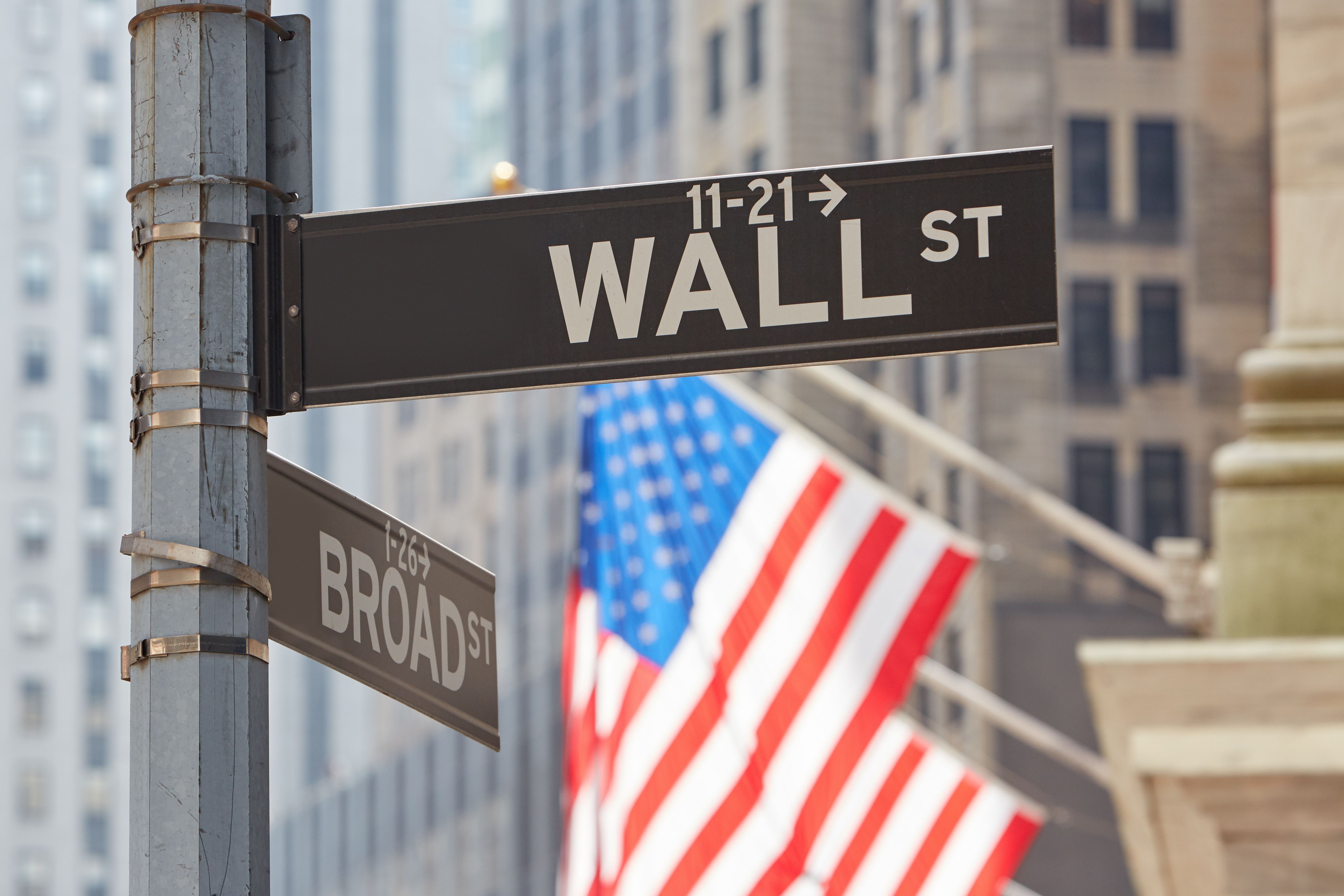 wall-street-sign-near-stock-exchange-with-us-flags-2021-08-26-22-35-03-utc.jpg